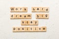 Work hard dream big stay positive word written on wood block. Work hard dream big stay positive text on cement table for Royalty Free Stock Photo