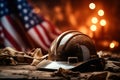 Work hard hat and elements of clothing on a wooden table against the background of the American flag. AI generation Royalty Free Stock Photo