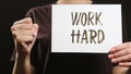 Work hard sign life challenge placard hand fist