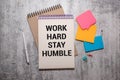 WORK HARD STAY HUMBLE text concept write on a notebook Royalty Free Stock Photo