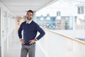 Work hard until success is within your clutch. Portrait of a confident young businessman standing in an office. Royalty Free Stock Photo