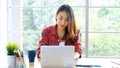 Work from home, Asian woman working with laptop computer at home, Asia female shopping online, Happy girl learning by internet, Royalty Free Stock Photo