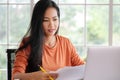 Work from home, Asian woman working with laptop computer at home, Asia female shopping online, Happy girl learning by internet, Royalty Free Stock Photo