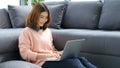 Work from home, Asian woman working with laptop computer at home office, Asia female shopping online, Happy girl learning by Royalty Free Stock Photo