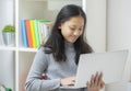 Work from home, Asian woman working with laptop computer at home office, Asia female shopping online, Happy girl learning by Royalty Free Stock Photo