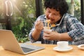 Work from home,Businessman working remotely from home. Using computer and eating cup noodle. Distance learning online education