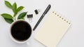 Work from home  with coffee cup, pen and notebook memo  on white background,top view Royalty Free Stock Photo