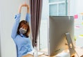 Beautiful young business woman wearing face mask protective quarantines disease coronavirus her stretching her arms Royalty Free Stock Photo