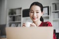 Portrait of beautiful young asian woman working on laptop in workplace Royalty Free Stock Photo