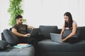 Work at home concept, Working from home, Couple using laptop working together in their living room. Corona virus, Covid-19, Stay Royalty Free Stock Photo