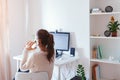 Work from home during coromavirus pandemic. Woman stays home. Workspace of freelancer. Office interior with computer Royalty Free Stock Photo