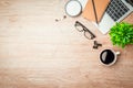 Work from home. desk office with laptop, blank notepad, coffee cup and pen on wood table. Flat lay top view copy spce Royalty Free Stock Photo