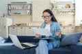 Work at home online. Busy young Asian woman architect, designer works at home Royalty Free Stock Photo