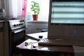 Work from home. Remote work via the Internet. Glasses and keyboard on the kitchen table