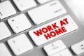 Work at home text button on keyboard, concept background Royalty Free Stock Photo
