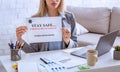 Work from home. Woman with inscription on remote workplace Royalty Free Stock Photo