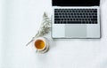 Work from home, workspace office at home, Notebook or laptop computer with Chinese tea cup  on the white desk at home office Royalty Free Stock Photo