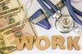Work in hospitals, clinics, occupational medicine and pharmacy concept photo. Stethoscope, neurological hammer, dollar bills and s Royalty Free Stock Photo