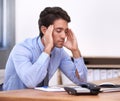 Work is just too much. A young businessman looking tired and frustrated in the office. Royalty Free Stock Photo