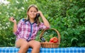 At work. kid on summer farm. Organic food. little girl vegetable in basket. Only natural. healthy food for children