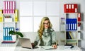 Work or Learnin. boss and employee. ideas for university project. businesswoman sitting in office. making notes while Royalty Free Stock Photo
