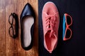 Work life balance choice concept: colored sneakers or sports shoes and strict office shoes Royalty Free Stock Photo