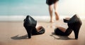 Work Life Balance Concept. Business Woman take off her Working Shoes and leave it on the Sand Beach for Walk into the Sea on Sunny Royalty Free Stock Photo