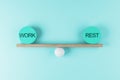 Work life balance concept with scales from wooden board on a ball and equal weight plates with words work and rest Royalty Free Stock Photo