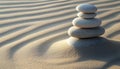 Work-life balance concept. Stacked stones on sand with pattern Royalty Free Stock Photo