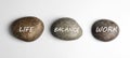 Work-life balance concept. Stones on background, top view