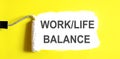 WORK LIFE BALANCE .One open can of paint with white brush on it on yellow background. Top view Royalty Free Stock Photo