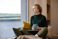 Work-life balance for women. A woman using laptop in the coziest place