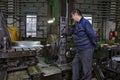 Work machine tool operator controls process of drilling steel pa