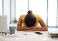 Work is making her miserable. a young businesswoman with her head down on her office desk. Royalty Free Stock Photo