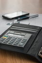 Work in office, desk concept with calculator and phone. Royalty Free Stock Photo