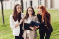 Work outside the office. Three successful caucasian businesswomen in suits standing on the street Royalty Free Stock Photo