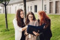 Work outside the office. Three successful caucasian businesswomen in suits standing on the street Royalty Free Stock Photo