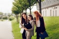 Work outside the office. Three successful caucasian businesswomen in suits standing on the street Royalty Free Stock Photo