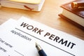 Work permit application on a table. Royalty Free Stock Photo