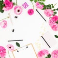 Work place with clipboard, pastel flowers and accessories on white background. Flat lay, top view. Blogger of freelancer concept w Royalty Free Stock Photo