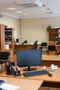 Work place with off lcd monitor of computer, keyboard and mouse are on table in empty room Royalty Free Stock Photo