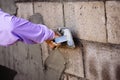 The work of a plasterer by applying plaster to the wall to have a smooth surface