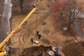 lifting works by truck crane. the work of plumbers when replacing old sewer pipes. Kharkiv region, LOZOVAYA, UKRAINE -