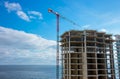 Work in progress, building tall luxury tower building by the sea.