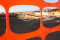 Work in progress on the sandy beach. open yard, between pipes and orange bars before the seasonal summer open sea Royalty Free Stock Photo