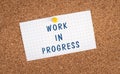 Work in progress is standing on a pinned paper, construction message, laber day, text note Royalty Free Stock Photo