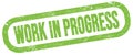 WORK IN PROGRESS, text written on green stamp sign Royalty Free Stock Photo