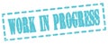 WORK IN PROGRESS text written on blue stamp sign Royalty Free Stock Photo