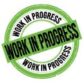 WORK IN PROGRESS text written on green-black round stamp sign Royalty Free Stock Photo