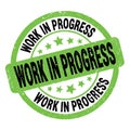 WORK IN PROGRESS text written on green-black round stamp sign Royalty Free Stock Photo